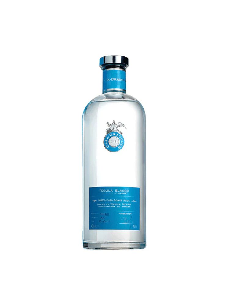 Casa Dragones Blanco Tequila bottle on white background.