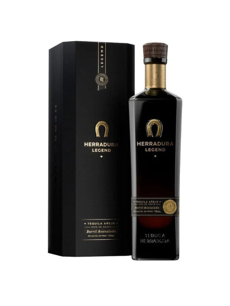 Herradura Legend Añejo Tequila bottle on white background.