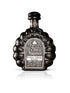 Tres Mujeres Extra Añejo Dark Tequila bottle on white background.
